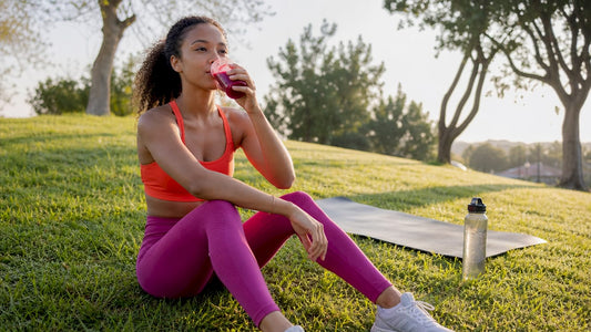 Athlete drinking beetroot juice in gym