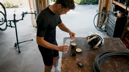 Cyclist preparing hydration formula at kitchen table